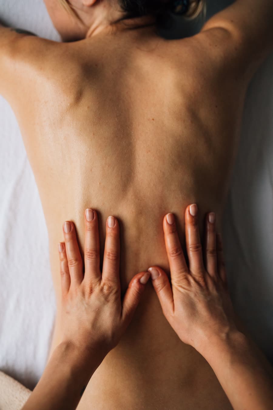 Massage treatment in progress, representing the calm, at-home experience across Ellie's coverage area